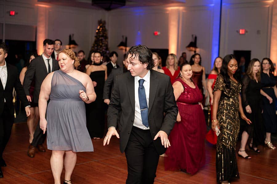Line dancers (and wannabe line dancers) keeping in time with the music at the 2025 Vertech Christmas party.