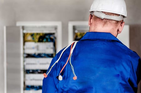 An electrician at a box.