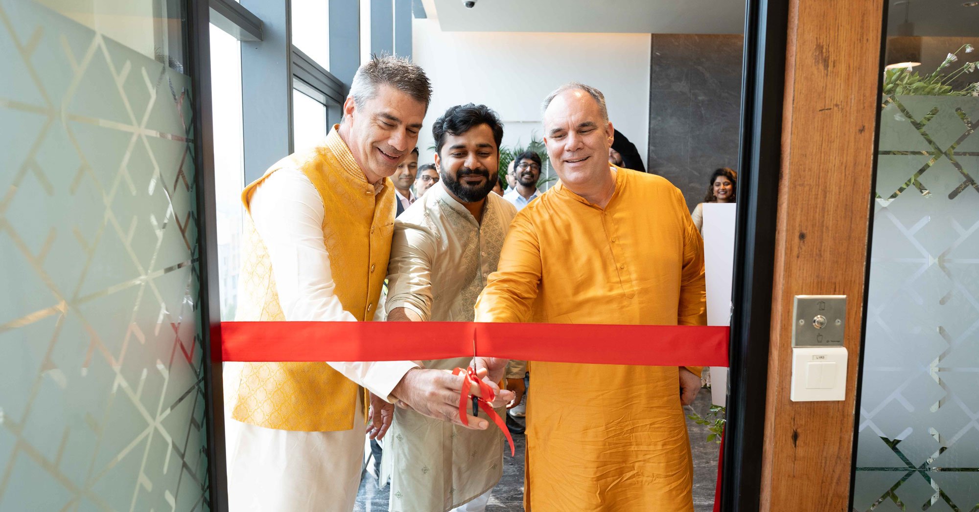 Ribbon cutting ceremony for Grand Opening of Pune, India office.