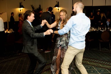 Three guests dancing together at the 2023 Vertech Christmas Party