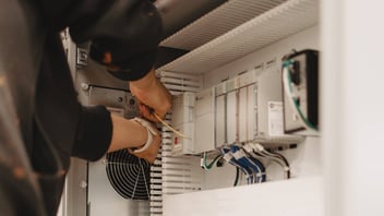 Vertech employee building an industrial control panel