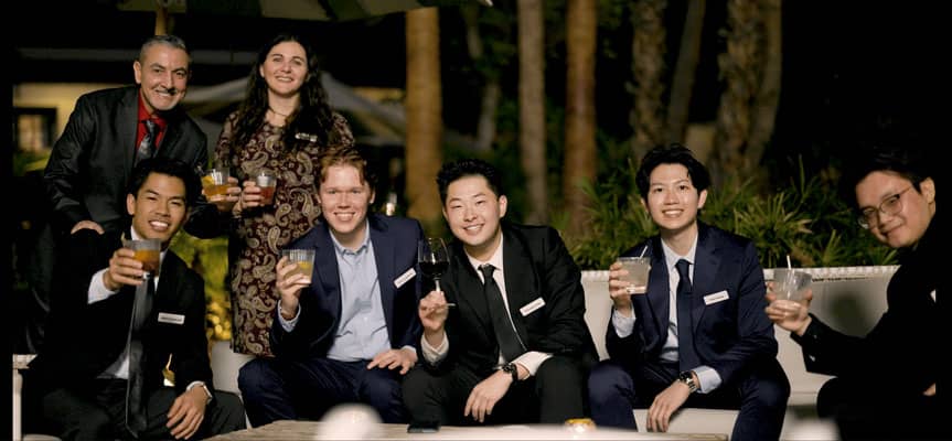 A group toasts the camera at the 2025 Vertech Christmas Party.