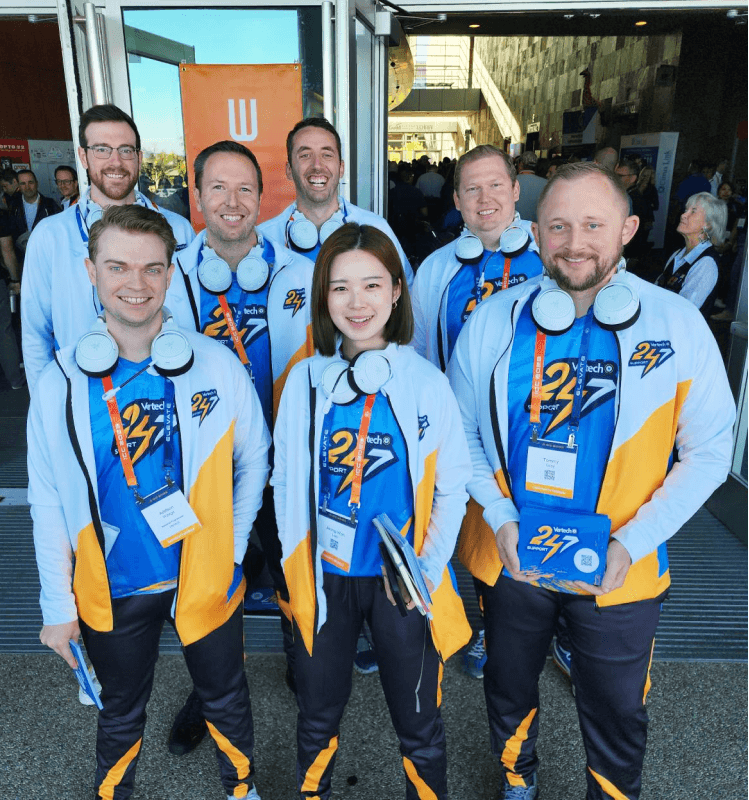 Vertech team members at the Ignition Community Conference wearing themed Esports outfits.